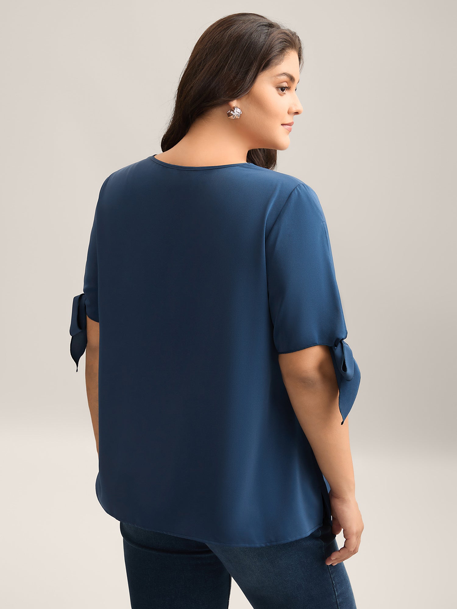 Laser Cut Neckline Knotted Sleeve Blouse