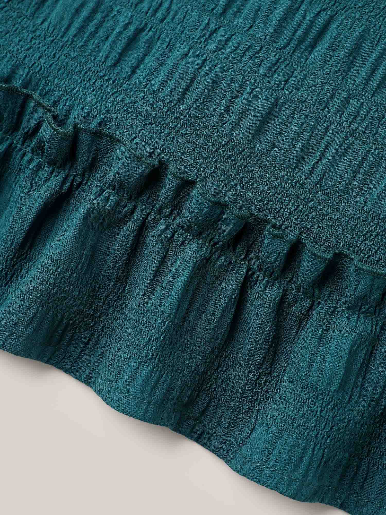 Textured Spliced Ruffle Edge Top