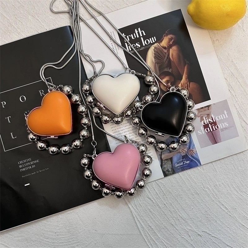 Women's Pu Leather Plastic Solid Color Streetwear Heart-shaped Clasp Frame Crossbody Bag