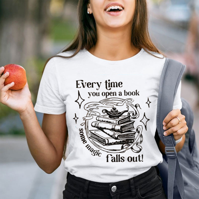 Every Time You Open A Book Some Magic Falls Out Teacher T-Shirt