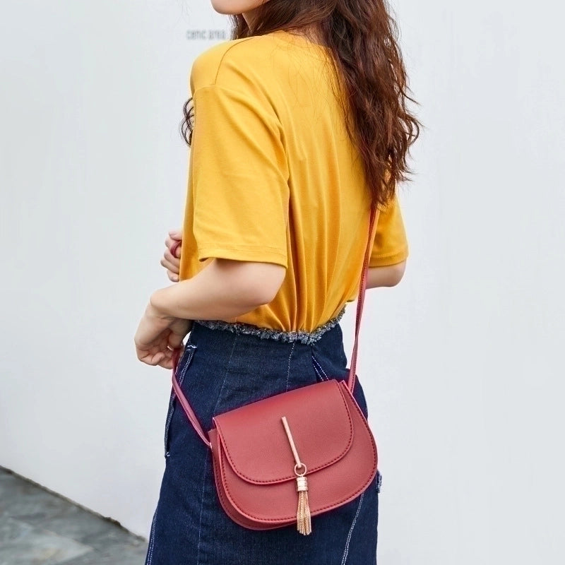 Women's Small Pu Leather Solid Color Elegant Tassel Oval Magnetic Buckle Crossbody Bag