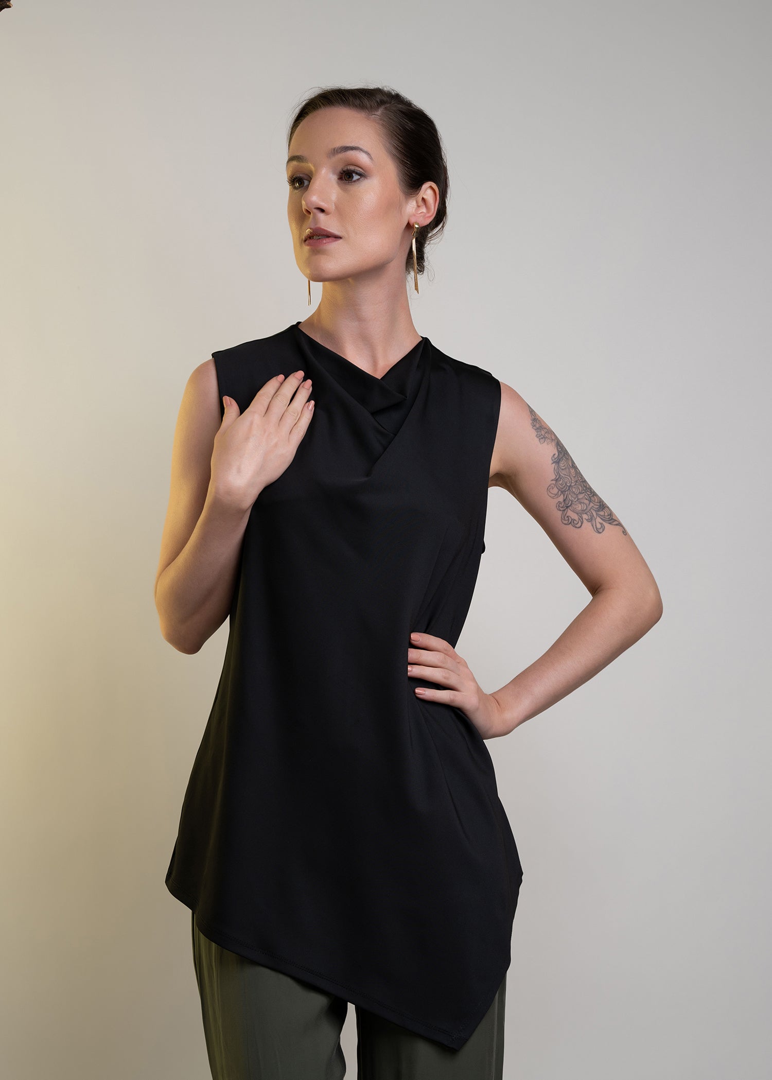 Sleeveless Round Neck Blouse With Asymmetrical Hem