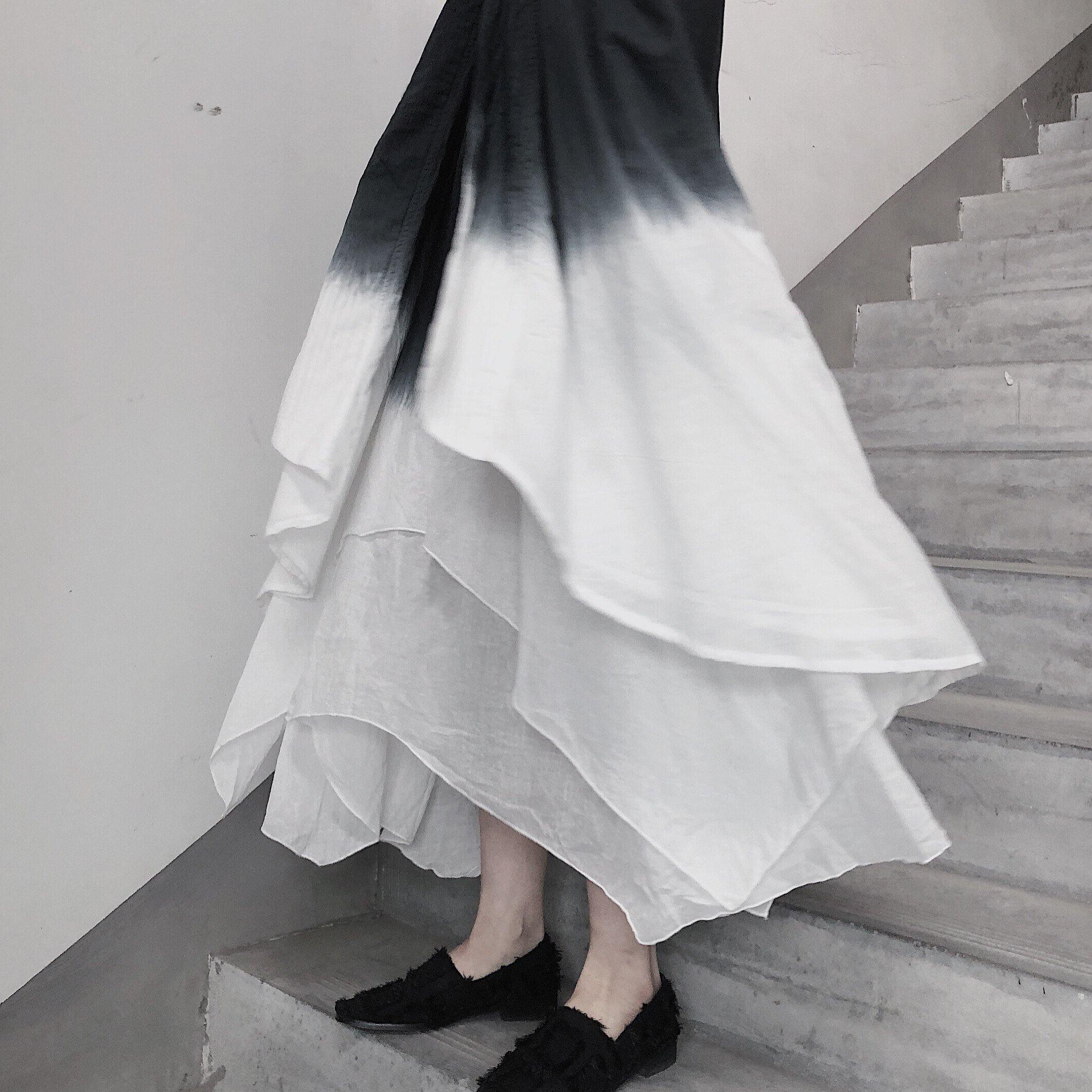 Double layer irregular swing suspender skirt