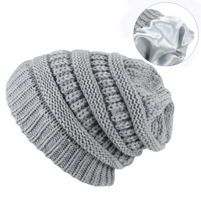 Autumn And Winter Solid Color Knitted Warm Ear Protection Hat Satin Lining Wool Cap Cap Cap Manufacturers Selling