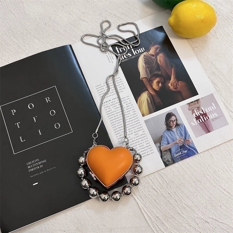 Women's Pu Leather Plastic Solid Color Streetwear Heart-shaped Clasp Frame Crossbody Bag