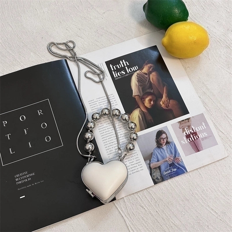 Women's Pu Leather Plastic Solid Color Streetwear Heart-shaped Clasp Frame Crossbody Bag