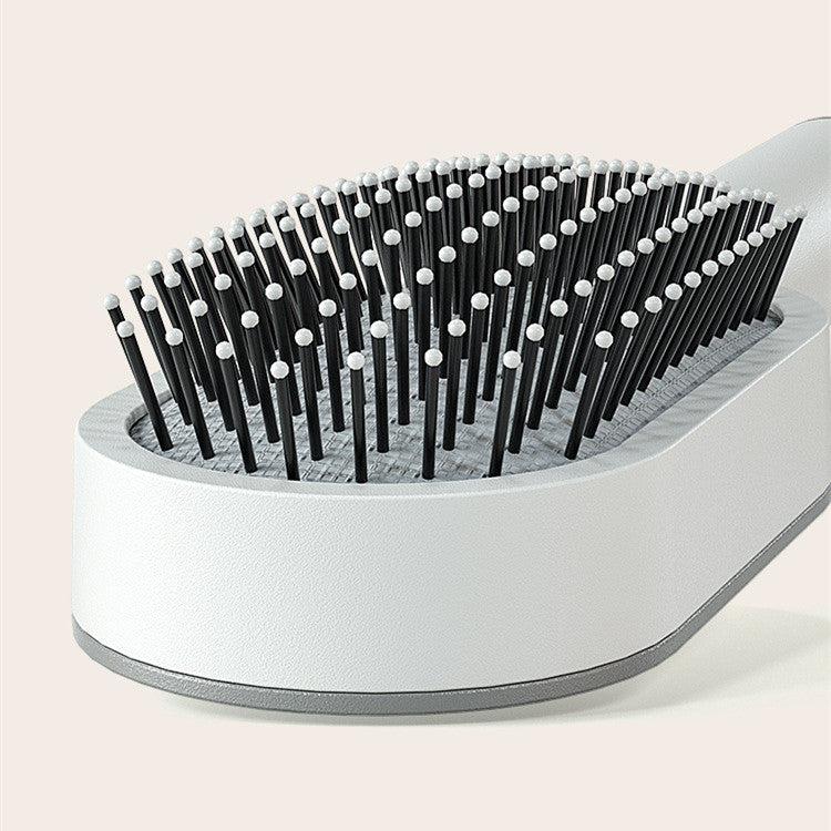 Self-cleaning hairbrush for women. One-button cleaning airbag to prevent hair loss