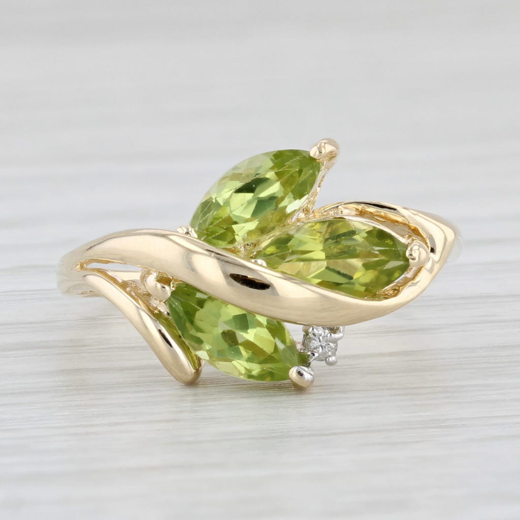 1.96ctw Peridot 3-Stone Ring 14k Yellow Gold Size 7.75 Diamond Accent