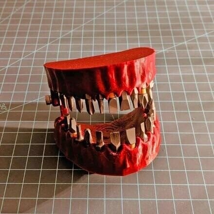 Bit holder for dentures