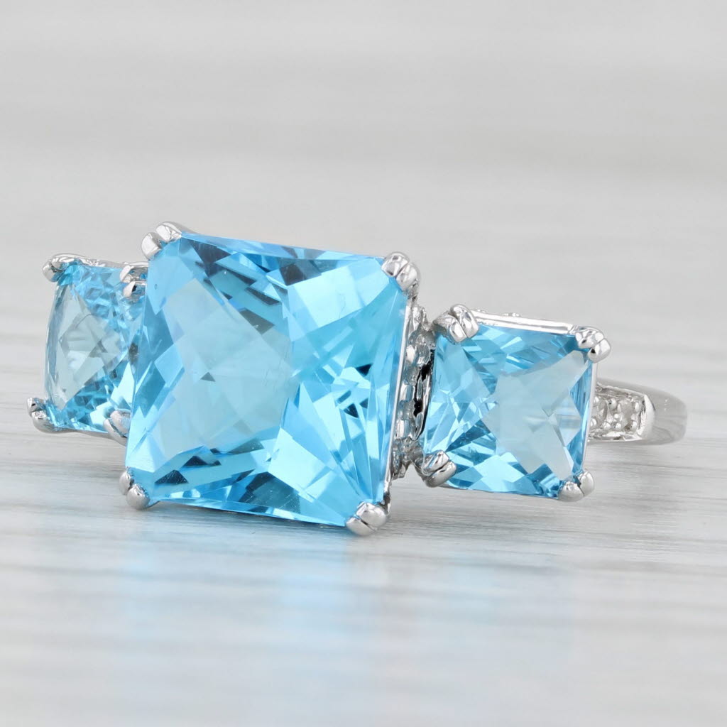 6.37ctw Blue Topaz 3-Stone Ring 10k White Gold Size 7 Diamond Accents