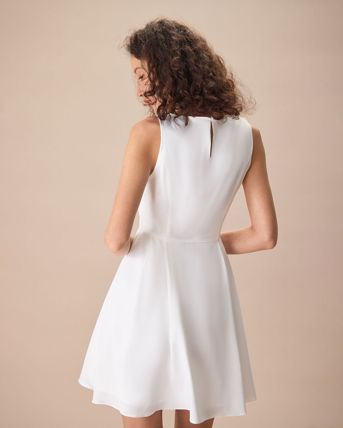 The White Round Neck Pleated Mini Dress