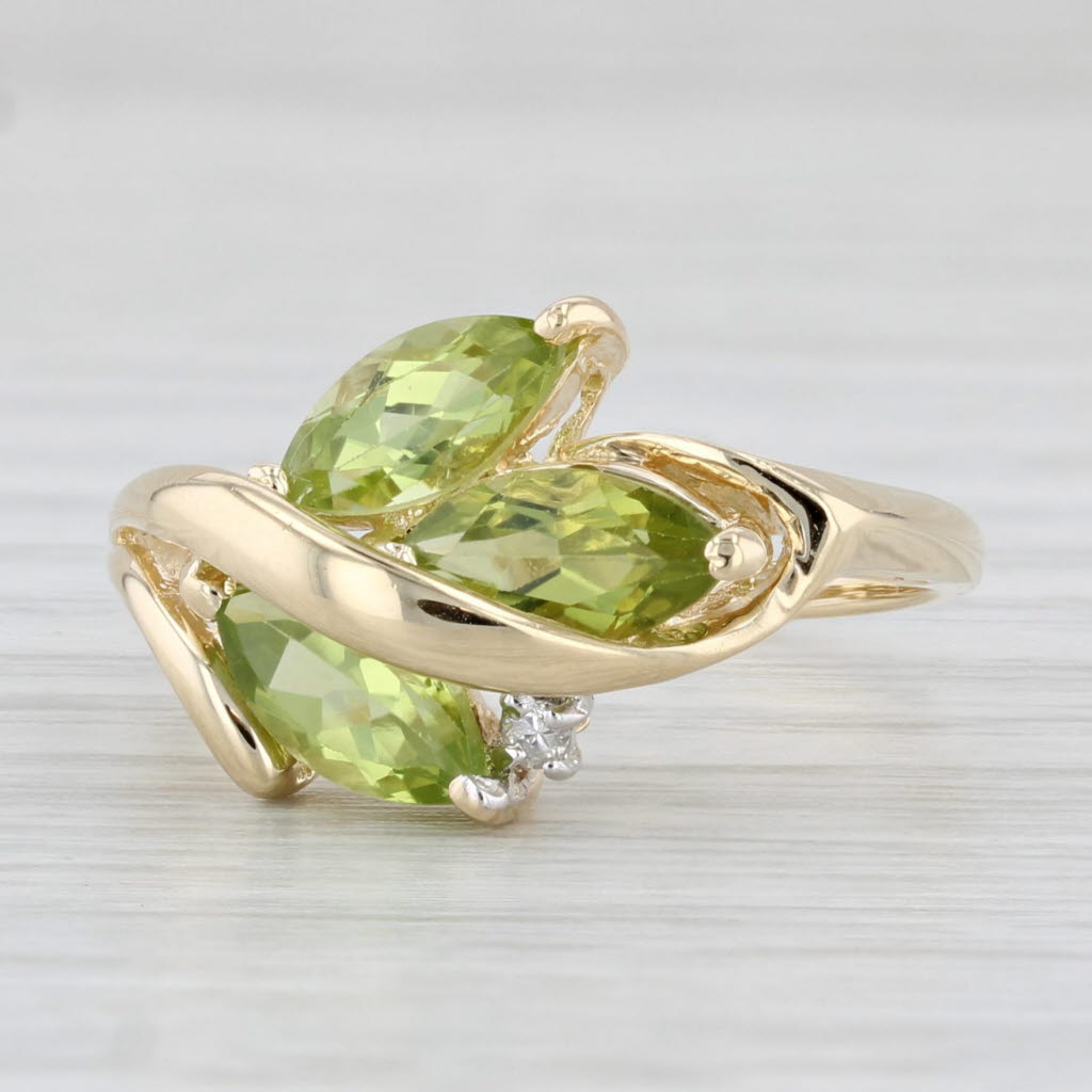 1.96ctw Peridot 3-Stone Ring 14k Yellow Gold Size 7.75 Diamond Accent