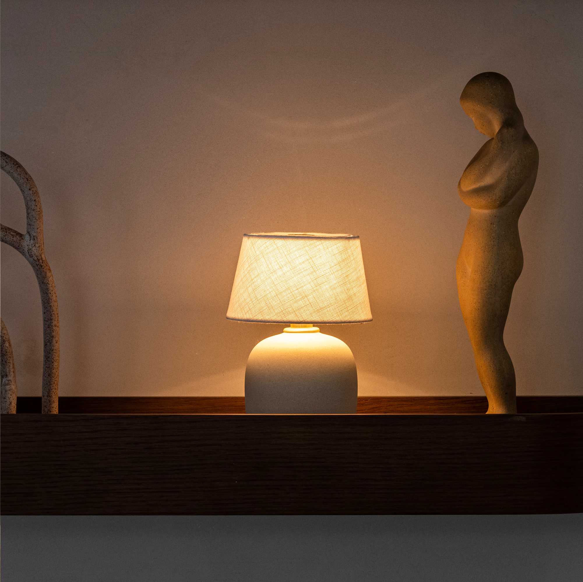 Torso portable table lamp. Sand