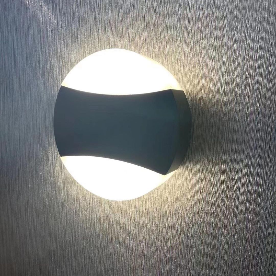 Modern LED Wall Light with Circular Design and Black Accents