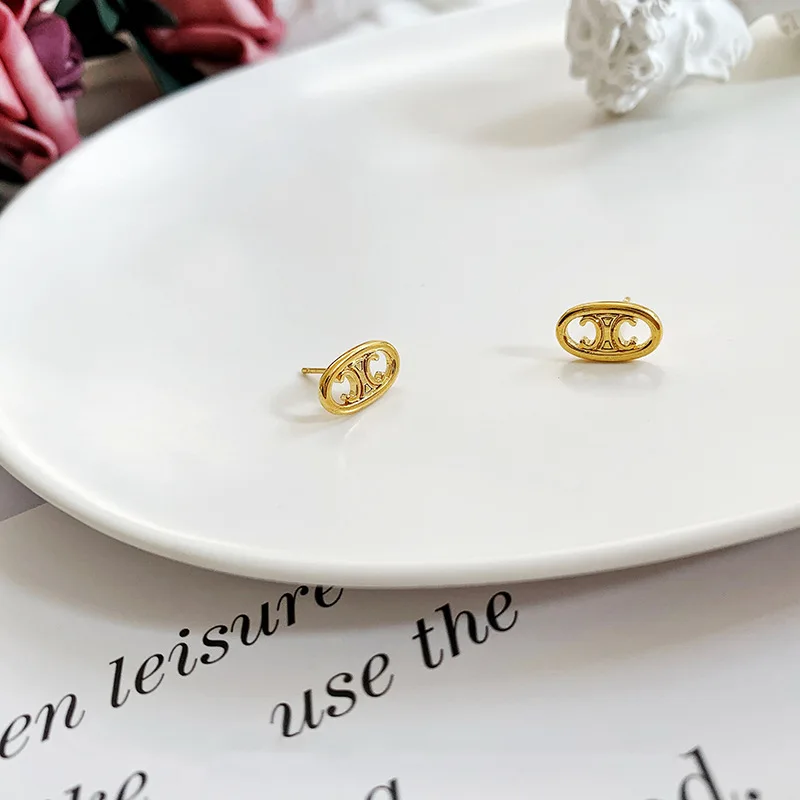 female delicate small Gold plated copper alloy hollowing triumphal arch stud earrings