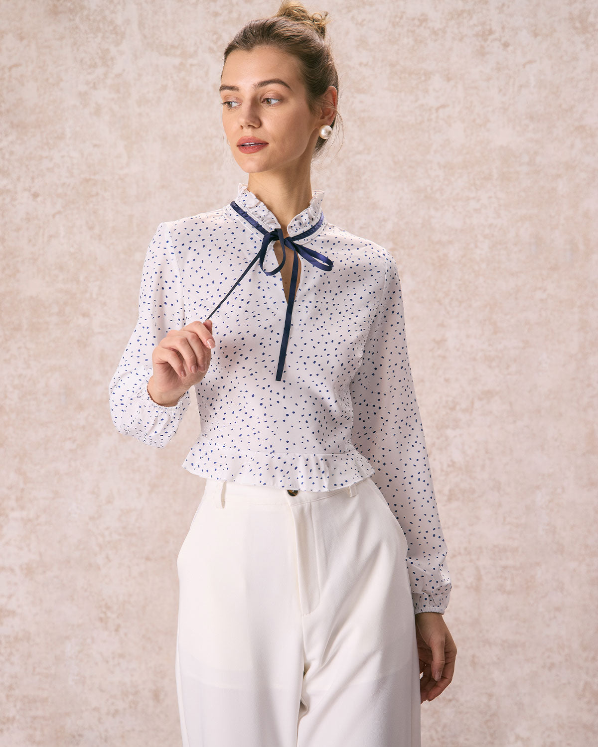 The White Mock Neck Polka Dot Ruffle Blouse