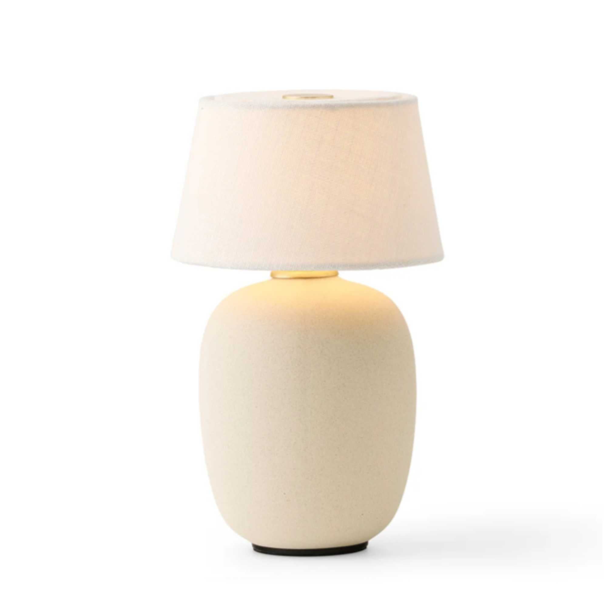 Torso portable table lamp. Sand