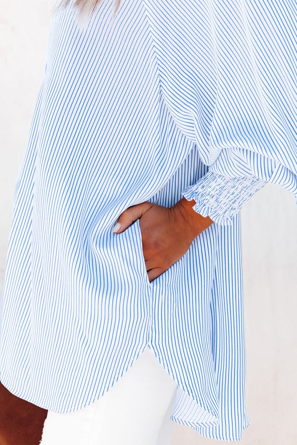 Mid-length shirt with striped lapel and oversized drawdown sleeves