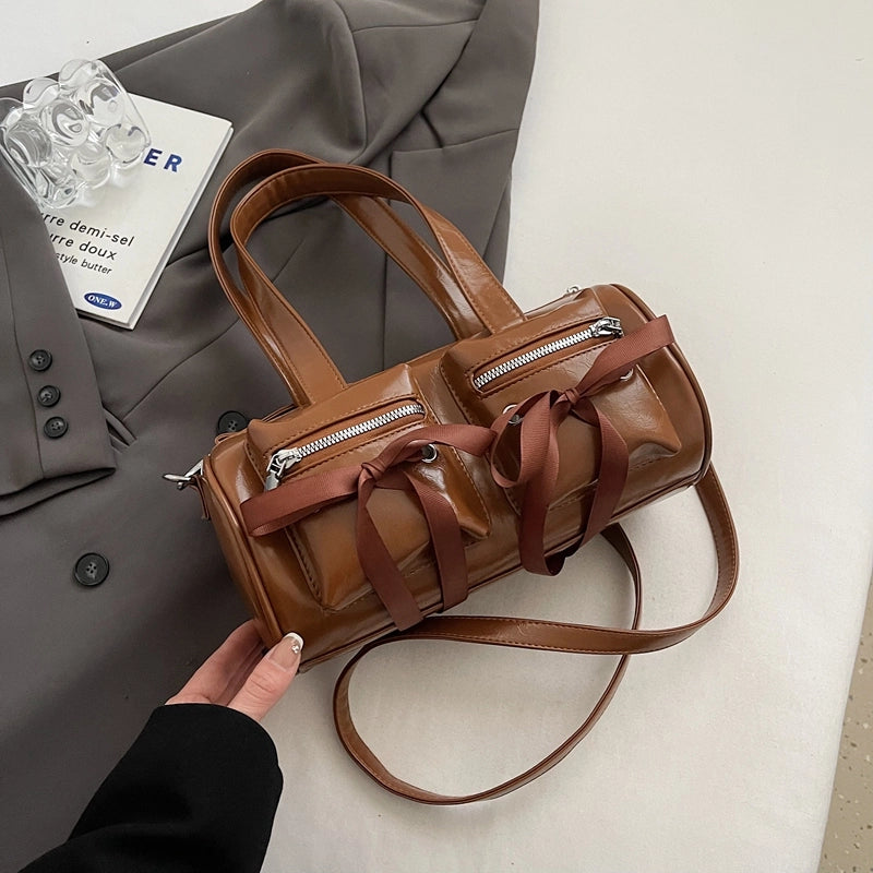 Women's Pu Leather Solid Color Bow Knot Classic Style Cylindrical Zipper Crossbody Bag