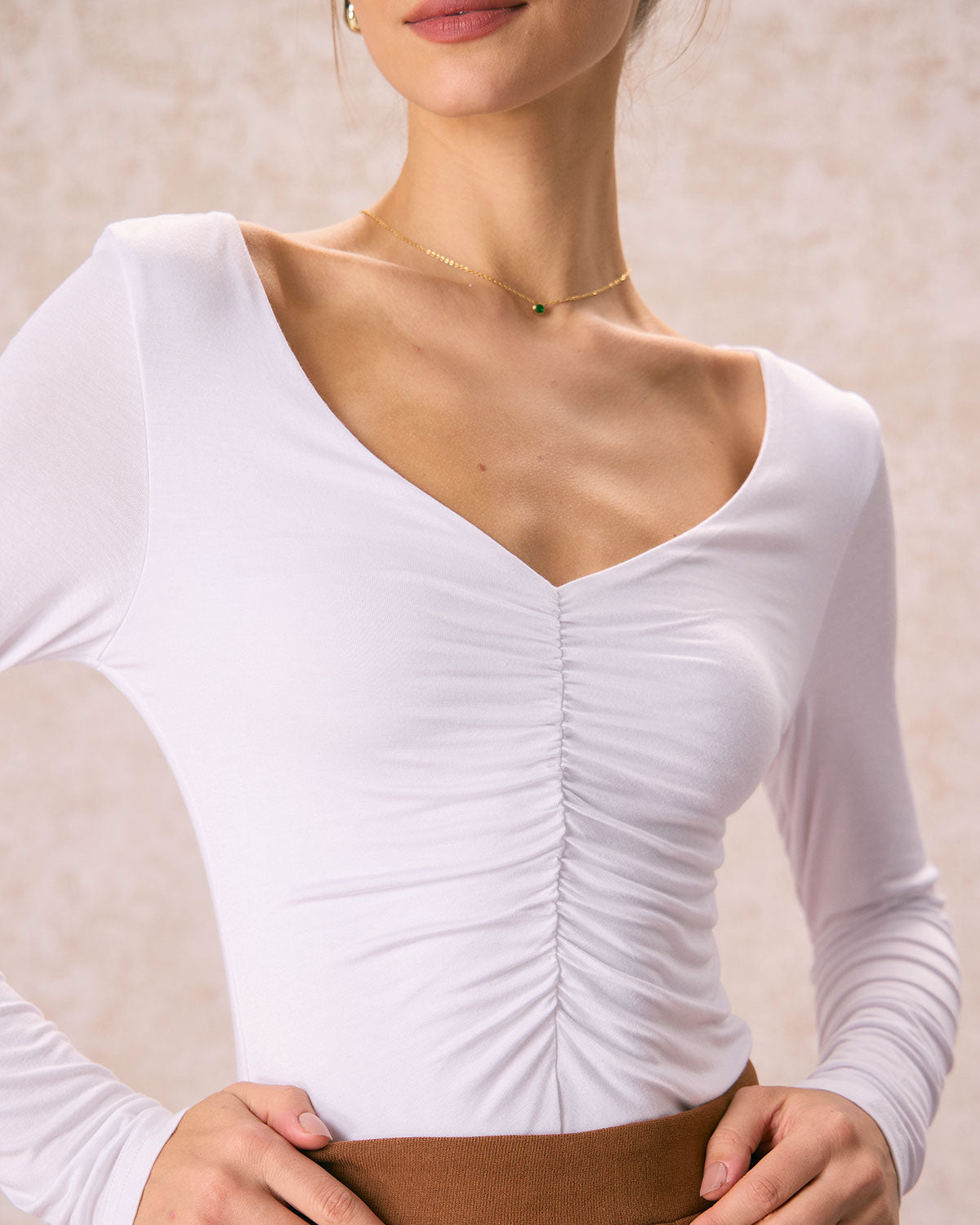 The White V Neck Ruched Long Sleeve Tee