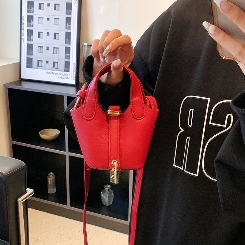 Women's Medium Pu Leather Solid Color Streetwear Bucket Lock Clasp Handbag Crossbody Bag