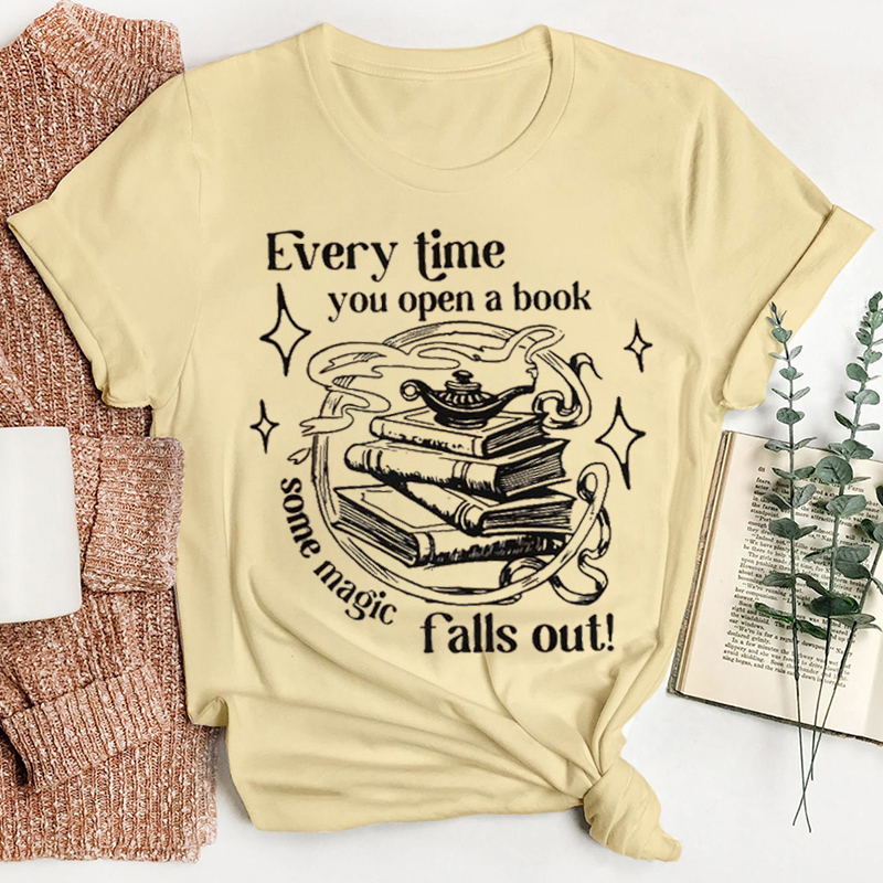 Every Time You Open A Book Some Magic Falls Out Teacher T-Shirt