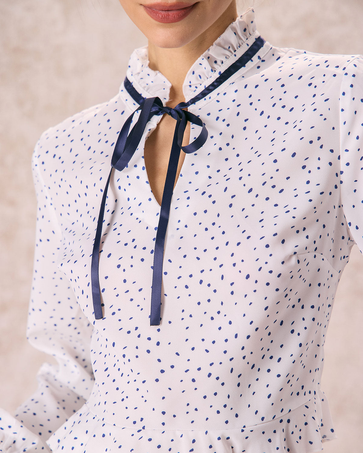 The White Mock Neck Polka Dot Ruffle Blouse