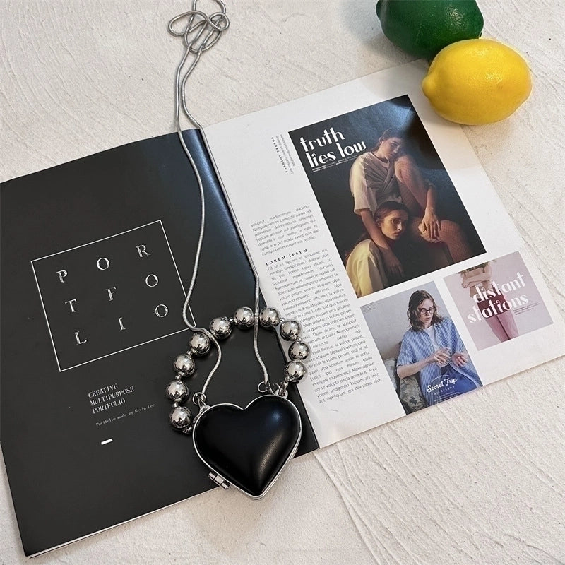 Women's Pu Leather Plastic Solid Color Streetwear Heart-shaped Clasp Frame Crossbody Bag