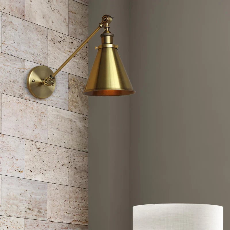 Industrial Wall Sconce with Adjustable Arm in Antique Brass Finish